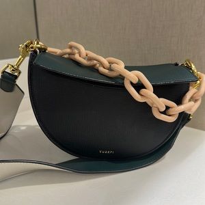 Yuzefi Leather multi colored purse with cream acrylic strap, gently worn